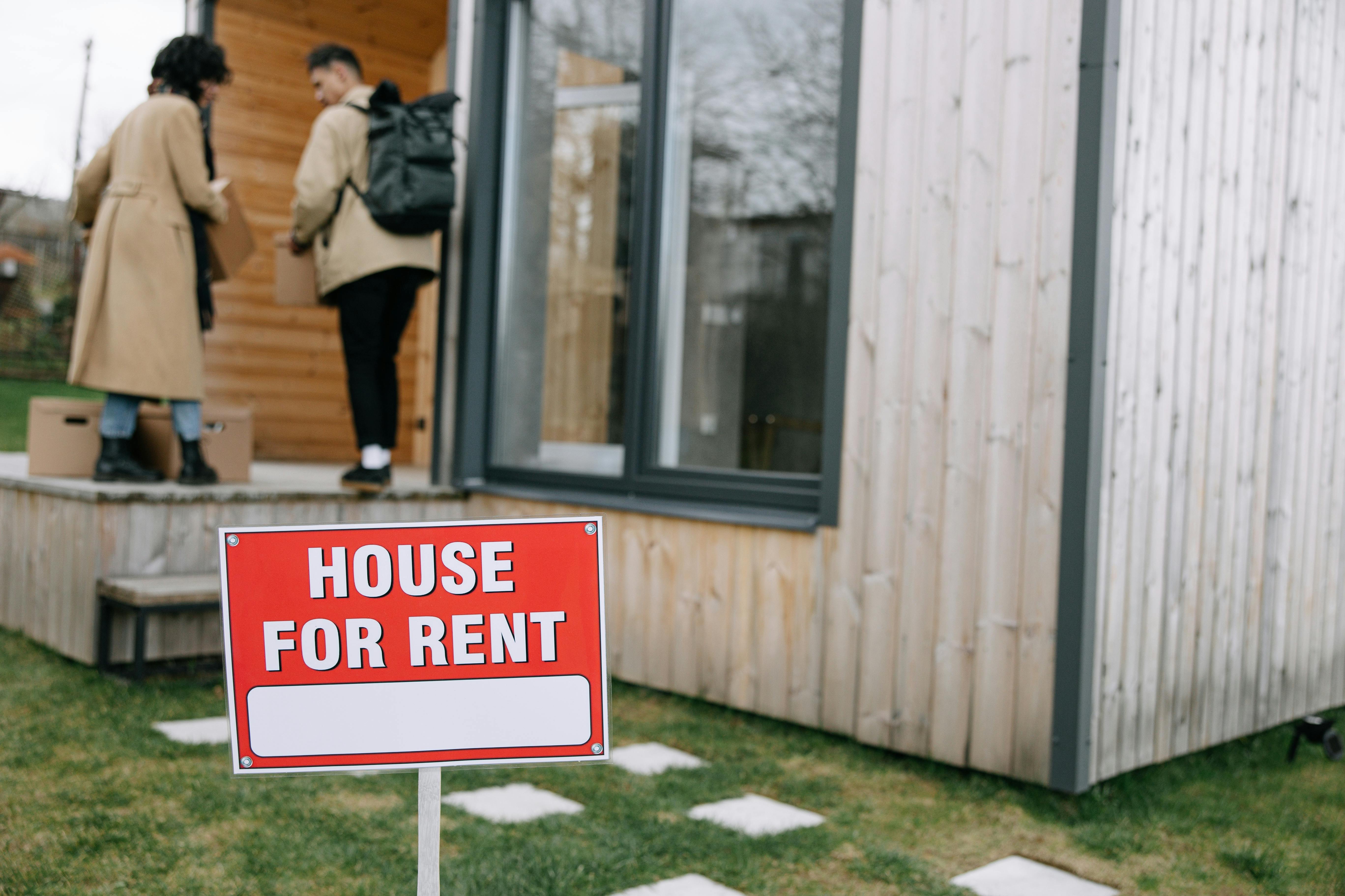 Prospective renters arriving at a house for rent managed by The Andel Group
